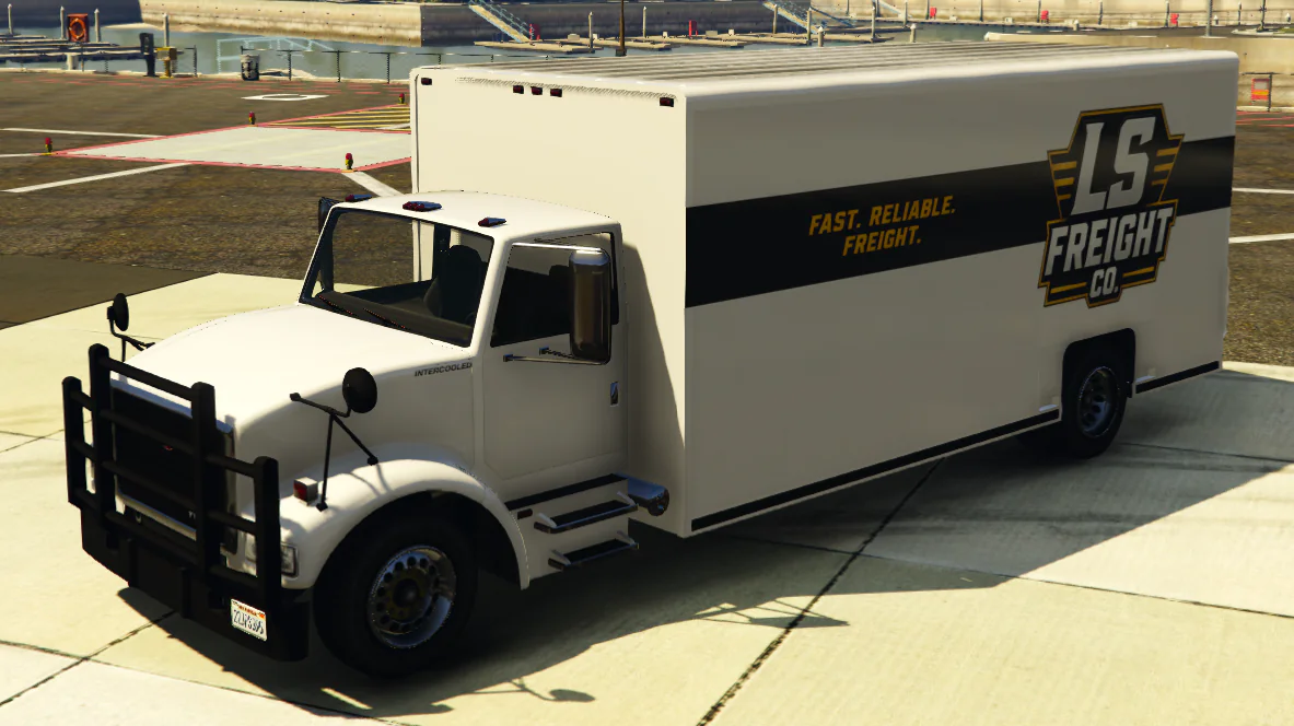 White LS Freight Benson box truck with black and gold company branding.